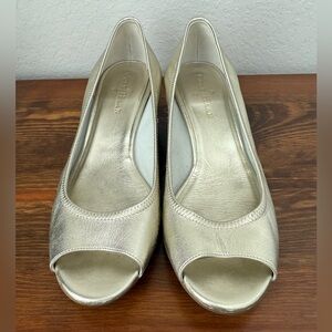 Women’s Cole Haan gold patent leather peep toe wedges. Size 8B